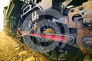 Iron wheels of stream engine locomotive train on railways track