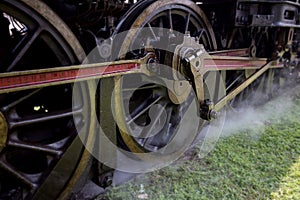 Iron Wheels of Stream engine locomotive train in station