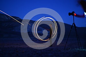 Iron wool circle drawing light fireworks. Burning Steel Wool spinning, Trajectories of burning sparks at night. Movement light eff