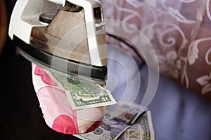 Ironing us dollars