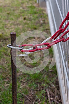 ironstick with chain and keylock on a fence