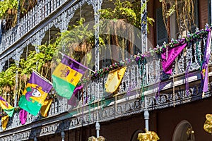 Ironwork galleries on the Streets of French Quarter decorated for Mardi Gras in New Orleans, Louisiana