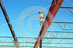 An Ironworker /Welder Awaits a Bar Joist