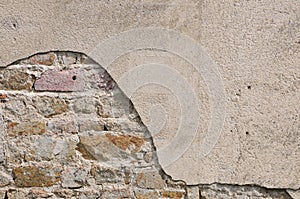 Irregular Old Stones Wall with cracked roughcast