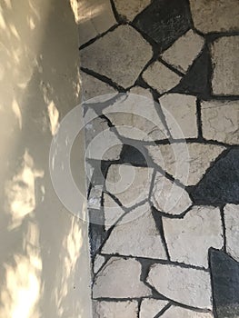 irregularly shaped stones of a wall covering