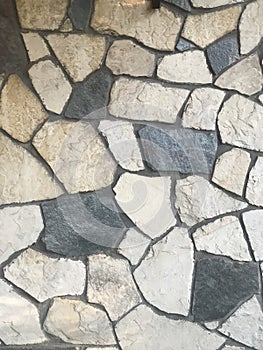 irregularly shaped stones of a wall covering