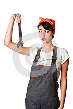 Irresolute girl with spanner