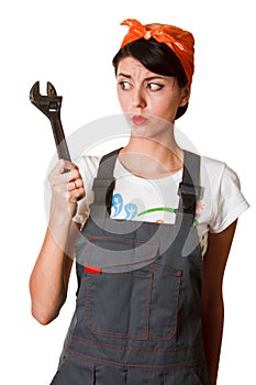 Irresolute girl with spanner
