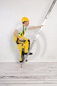 Irresponsible use of a ladder during construction work.