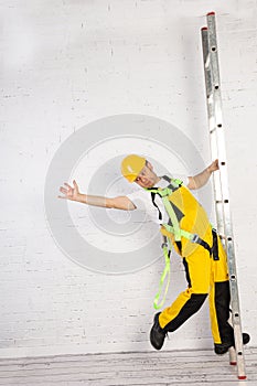 Irresponsible use of a ladder during construction work.