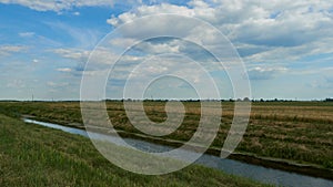 irrigation canal along the field. Reclamation channel for improving hydrological, soil and agro-climatic conditions in order to