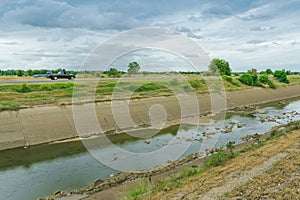 Irrigation canal or irrigation channel in concrete wall Send water from the reservoir to the agricultural area of â€‹â€‹the farmer