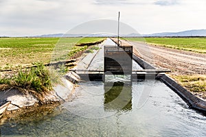 Irrigation Ditch with Flowing Water photo