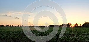 irrigation farm fields sunset hot air balloon water trees