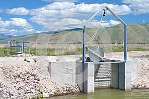 Irrigation Flood Control Gate in Bear Valley River Wildlife Refuge, Idaho. Horizontal. Also known as Dingle Marsh or Swamp