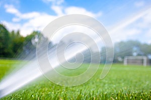 irrigation with the help of pressure jets with water at the football stadium