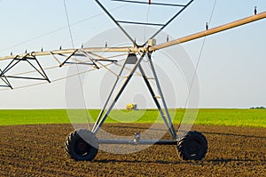 Irrigation system and combine harvesting green peas