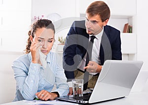 irritable boss man accusing crying woman to making mistake