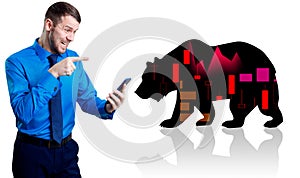 Irritated businessman holding smartphone near silhouette of bear.