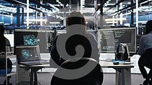 Irritated data center engineer punching desk, irked by glitches