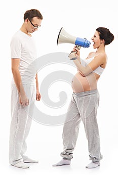 Irritated pregnant woman screaming on her husband