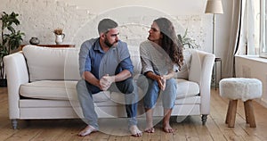 Irritated young couple arguing, having difficulties in relationships