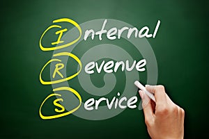 IRS - Internal Revenue Service acronym, business concept on blackboard photo