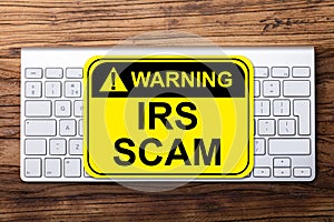 IRS Scam Warning Sign On Keyboard