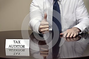 IRS Tax Auditor Thumbs Up Sign photo