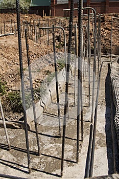 irst stage of pouring the Foundation for a new building with cement and reinforcements with steel bars and wire rod