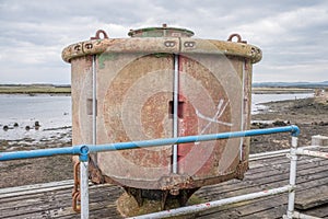 Irvine Harbour in Ayrshire Scotland looking Over some Old Rusting Maritime Channel Buoy.