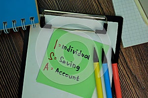 ISA - Individual Saving Account write on sticky notes isolated on Wooden Table
