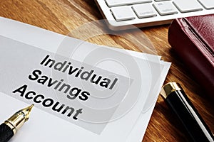 ISA Individual Savings Account. Business papers on an office desk