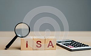 ISA - Individual Savings Account on a wooden blocks. Class of retail investment arrangement available to residents of the United