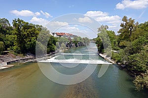 Isar river with rapids in Munich center in spring day photo