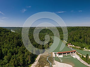 Isar weir in southern Bavaria with fish stairs next to a beautiful forest at a beautiful day.