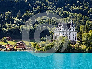 Iseltwald castle, view from alpine lake Brienz