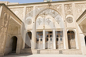 Isfahan Province- Kashan  IRAN-April 30- 2019 wooden windows and wall carving inside Borujerdi house