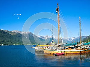 Isfjorden fjord and adjacent mountains and sailboat in Andalsnes, Norway