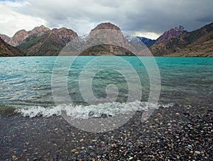 Iskander kul lake in rocky landscape in the Fan Mountains