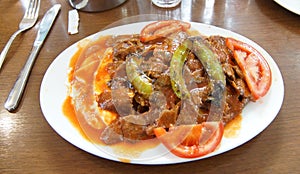 Iskender kababs in tomato sauce