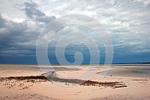 Isla Blanca beach under stormy skies on the Isla Blanca peninsula Cancun Mexico