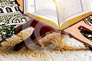 Islam holy book of Muslims, the Quran, is placed on a wooden sta