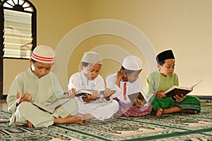 Islam Kids Reading Koran photo