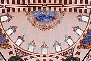 Islamic art decoration at the Sehzade Mosque in Istanbul, Turkey. Interior view of the main dome.
