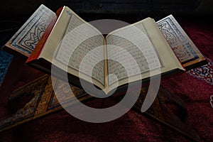 Islamic background photo. The Holy Quran or Kuran-i Kerim on the lectern.