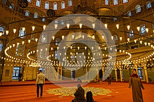 Islamic background photo. Muslims praying in Eminonu New Mosque or Yeni Cami