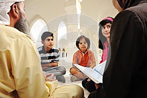 Islamic education inside white mosque,