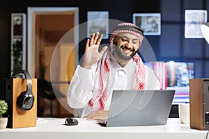 Islamic guy engrossed in video call