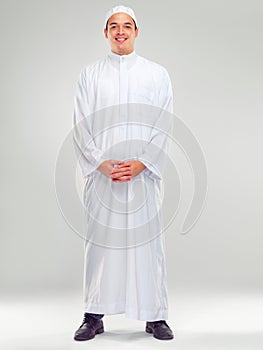 Islamic man, religion fashion and standing for worship, prayer or spiritual happiness in white background. Arabic person